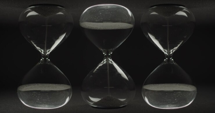 Three sand clocks pouring