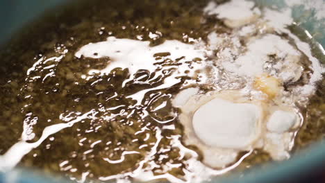 Pastry-chef-pouring-flour-into-a-bowl-in-slow-motion