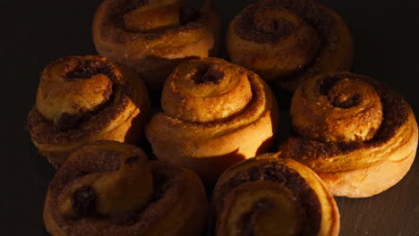 freshly baked cinnamon rolls - cinnamon swirl pastry. - closeup shot