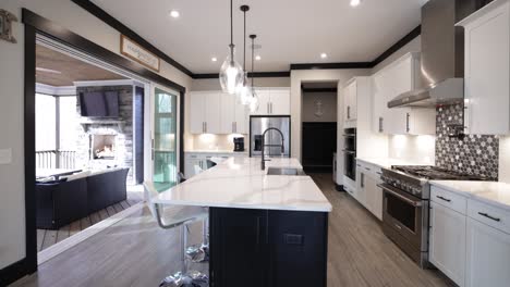 camera panorama across a modern open living space with patio and fireplace