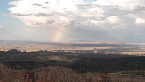 a rainbow over the grand canyon