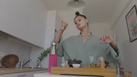 woman performing a tea ceremony with incense
