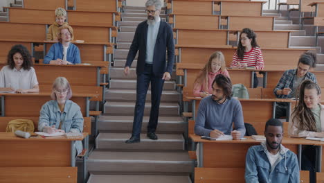 professor giving a lecture in an amphitheater