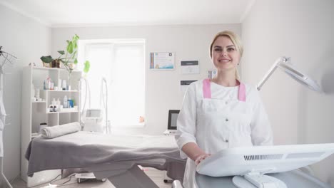 hardware procedure in cosmetology. cosmetologist smoothes wrinkles with microcurrent. peeling, phonophoresis, massage and facelift in a beauty clinic.