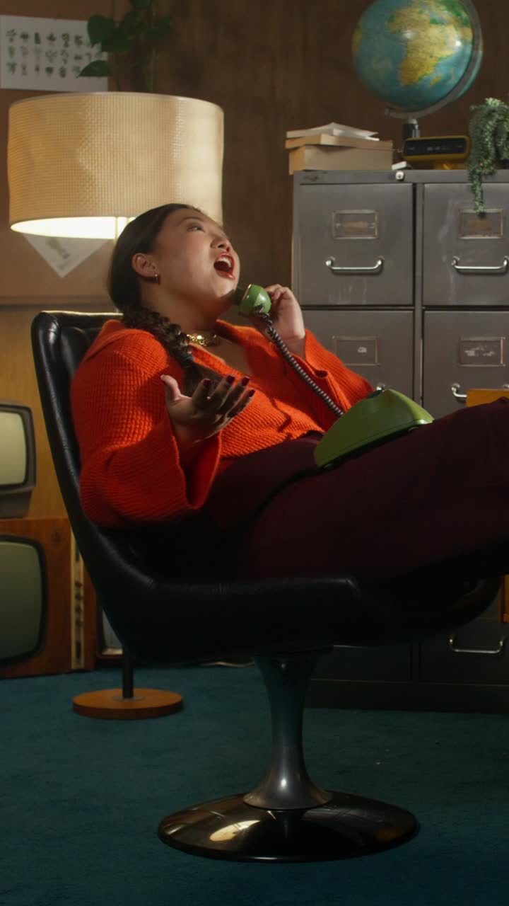 Woman Talking on a Retro Telephone in a Vintage Office