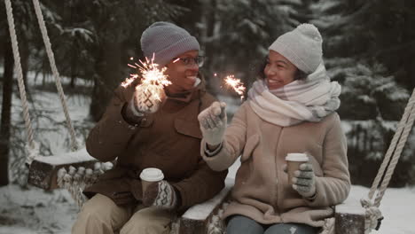 couple enjoying a winter date on a swing