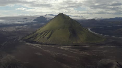 maelifell volcano against cloudy sky in southern iceland - aerial shot