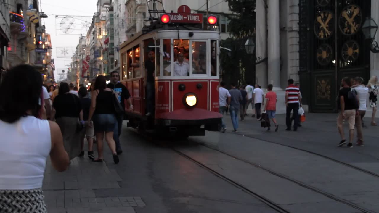 The Istanbul nostalgic tramway heritage tram is passing by Istiklal Avenue in Turkey