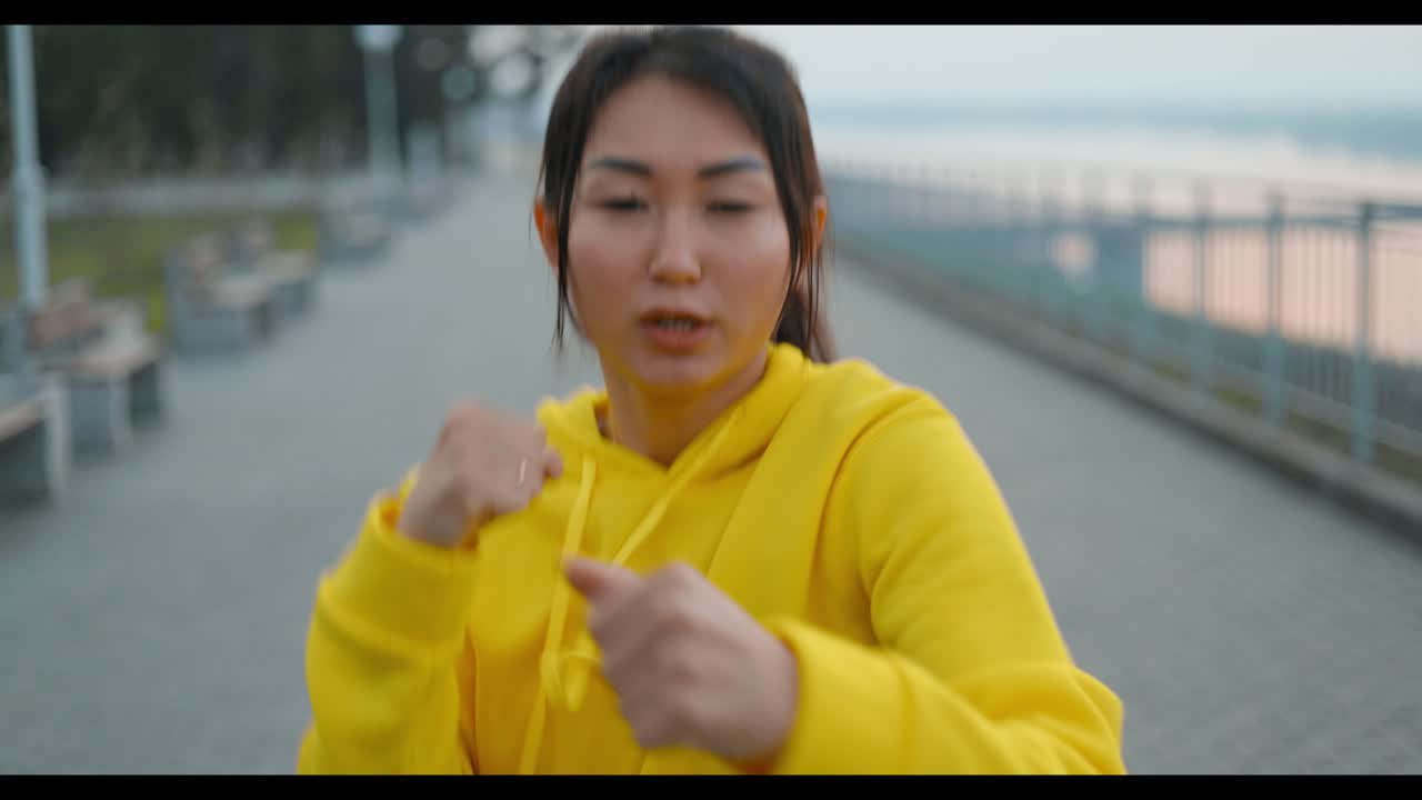 Woman Practicing Self-Defense in a Park