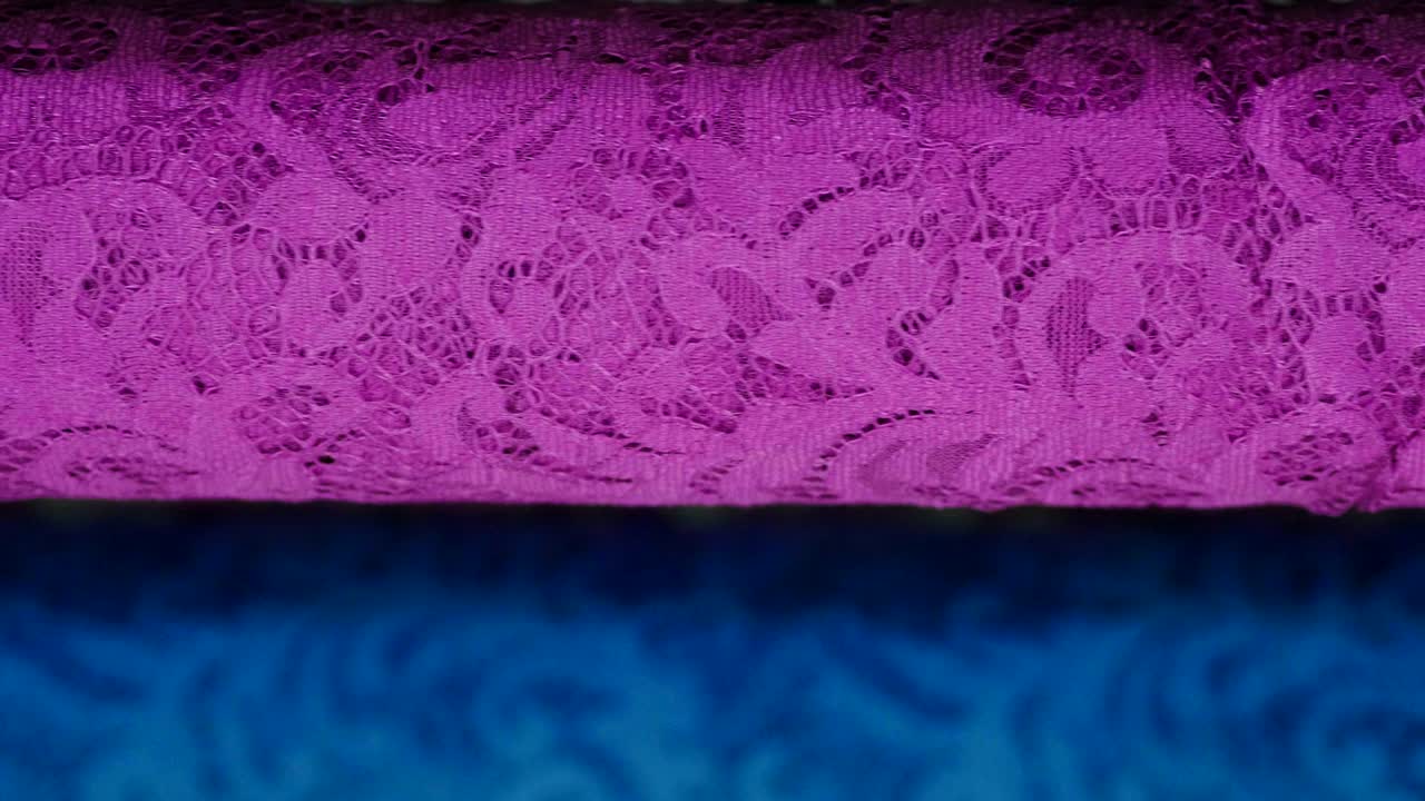 una foto macro de un encaje, tela utilizada para hacer elegantes vestidos de novia para el día de la boda.