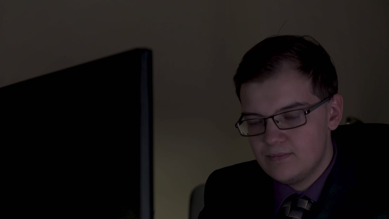 Man Working Late at Night on Computer