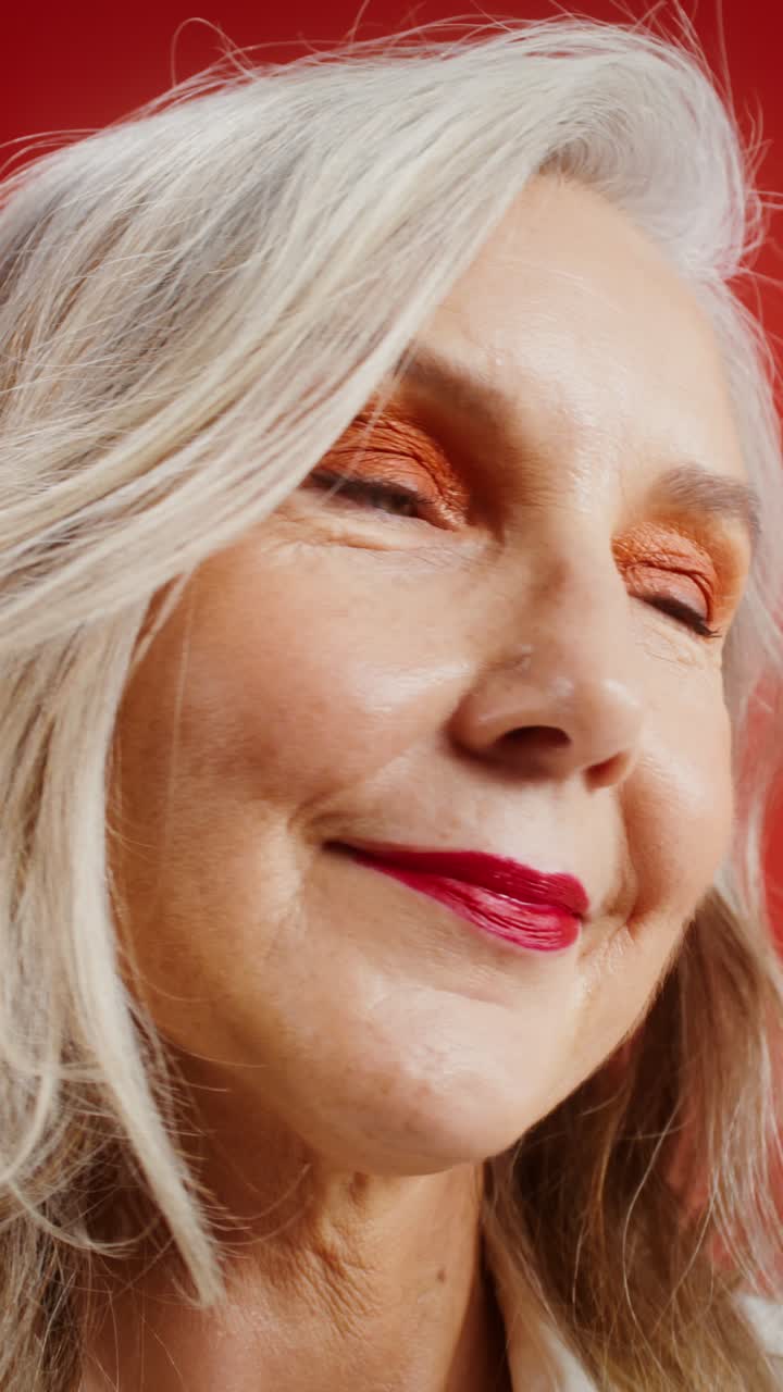 Elegant Older Woman Applying Lipstick