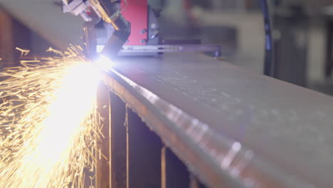 beam-cutting-a-metal-plate-in-slow-motion