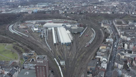 Aerial-panoramic-footage-of-railway-depot.-Repair-shop-and-train-operator-facilities.-Passenger-transport-concept.-Cologne,-Germany