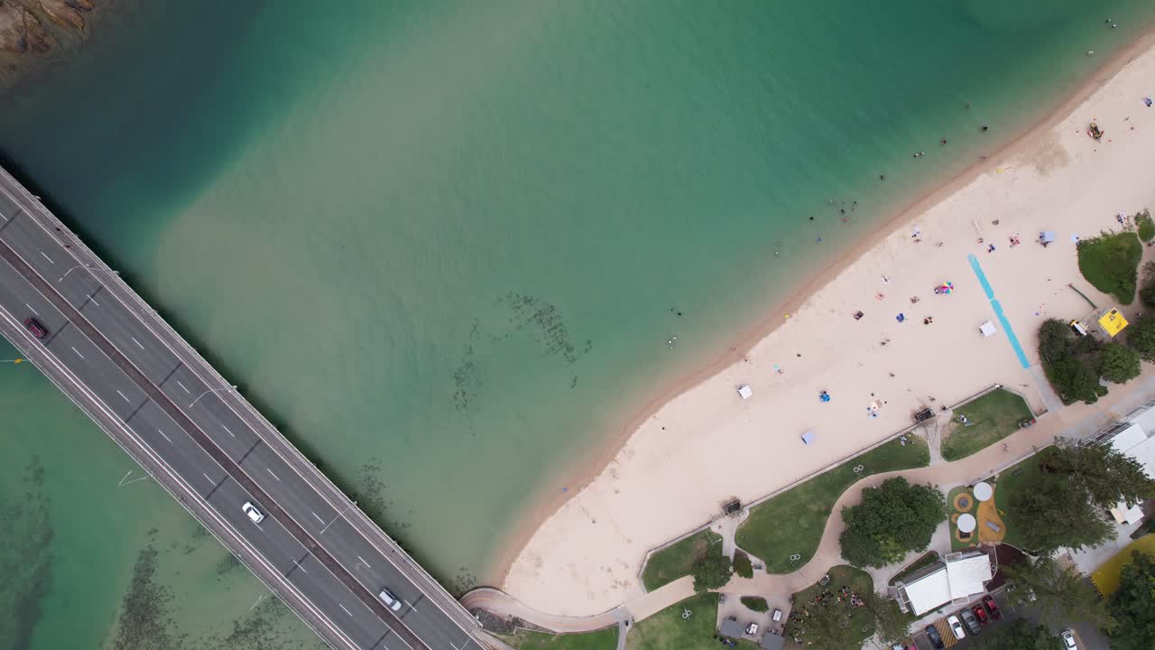 Tourists Relaxing At Tallebudgera Creek Beach In Palm Beach, Queensland, Australia.