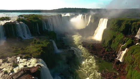 Aerial---Iguazu-Falls-and-river-in-Misiones,-Argentina,-wide-approaching-shot