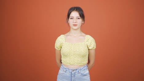 Young-woman-looking-at-camera-with-dull-expression.