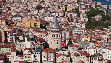 forward dolly shot toward istanbul's famous galata tower. pan up reveal cityscape