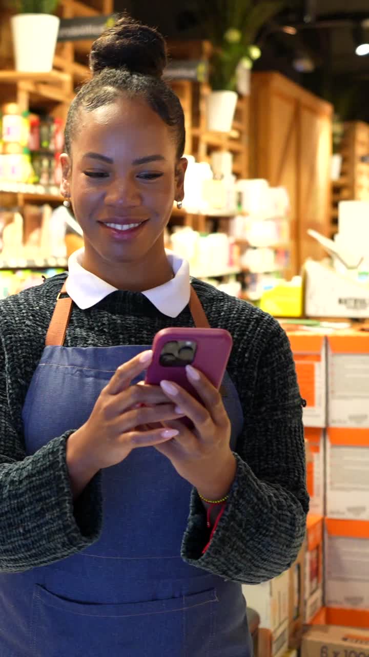 Woman using cell phone in grocery store