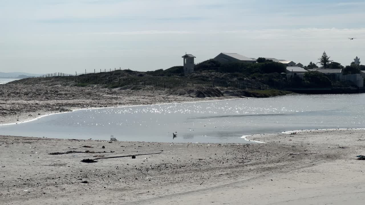 Water shimmers on the water in the afternoon light on the lagoon at Milnerton in Cape Town.