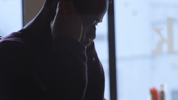 Man wearing earphone in cafe