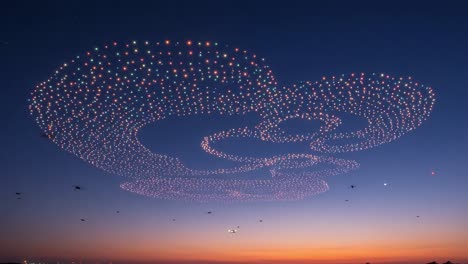 A Stunning Display of Colorful Drones Painting the Night Sky with Luminous Patterns during the Twilight Hour, Creating a Magical Atmosphere of Light and Innovation