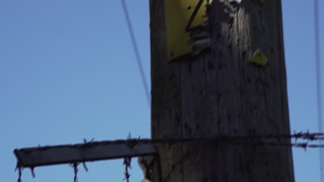 barbed wire on a pylon pole