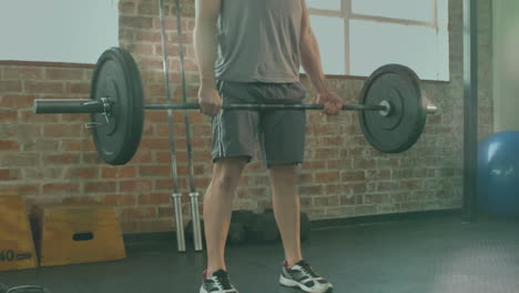 animación de manchas brillantes sobre un hombre fuerte haciendo ejercicio en el gimnasio