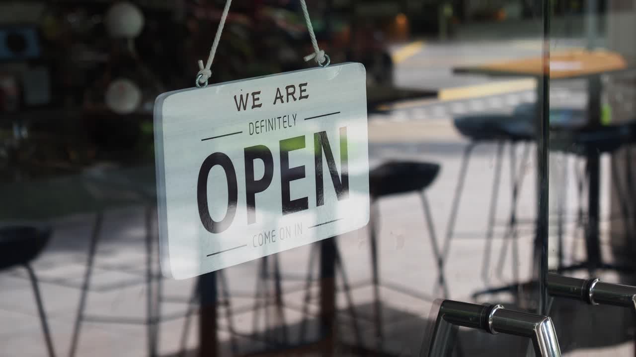 Open sign on a glass door
