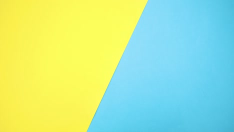 kids toys appear on right side of blue and yellow background - stop motion