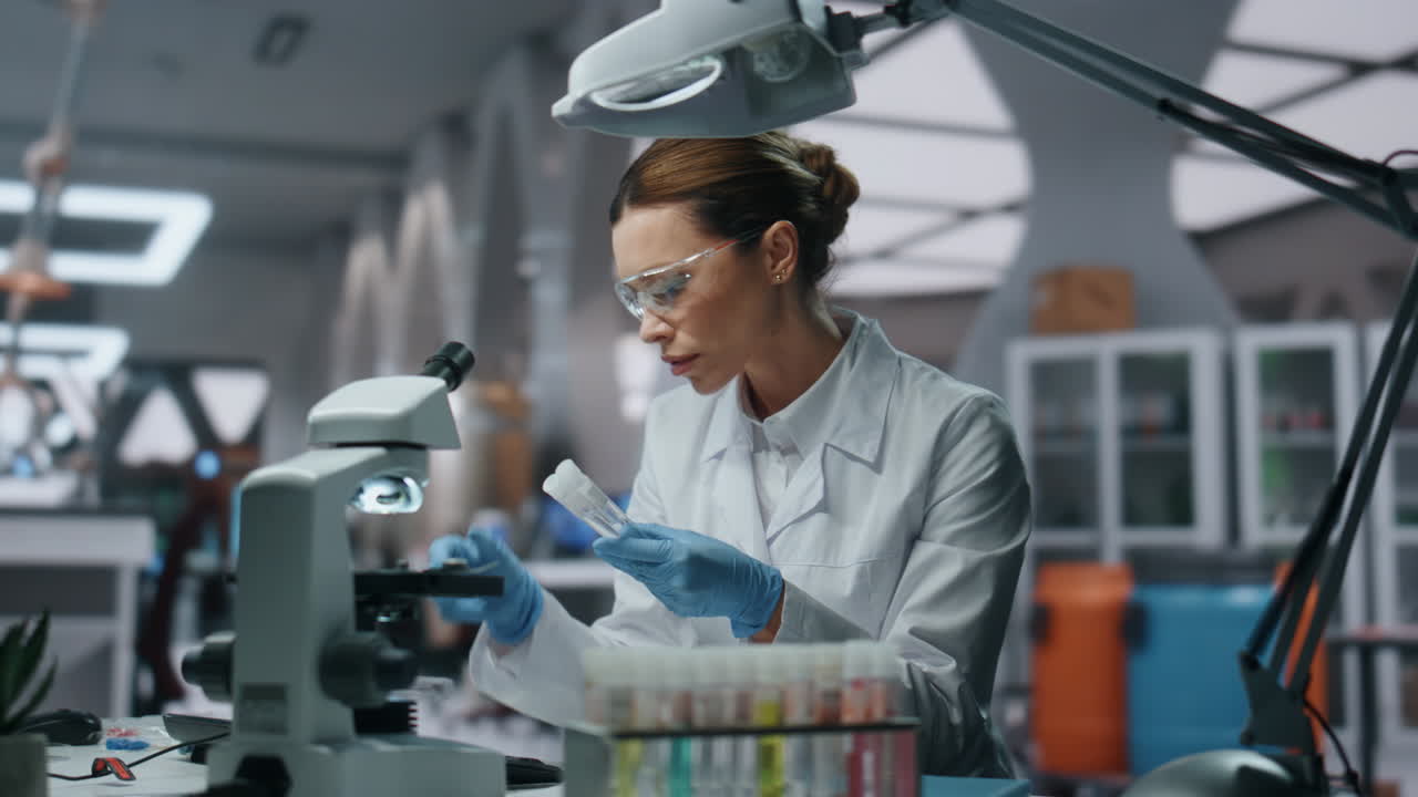 Laboratory scientist looking drugs samples in modern innovation clinic close up.