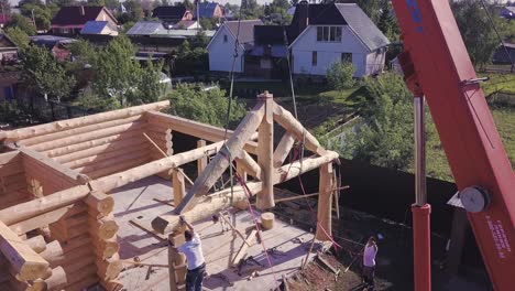 log cabin construction with crane