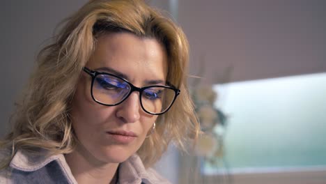 attractive woman wearing glasses studying