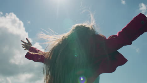 young girl moves long hair young girl moves long hair on beautiful greenery hill enjoying flows of warm wind watching at amazing landscape spending leisure time outdoor back view slow motion