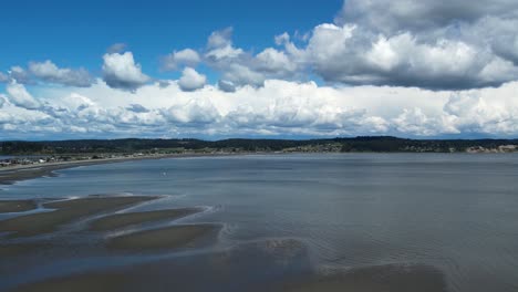 Drone-flight-over-Double-Bluff-Beach.-Freeland,-WA