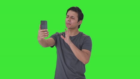 Angry-Indian-man-shouting-on-video-call-Green-screen