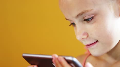 Schoolgirl-using-mobile-phone-in-classroom