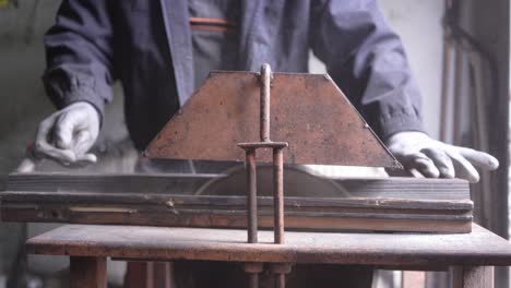 cutting peas of wood on circular saw