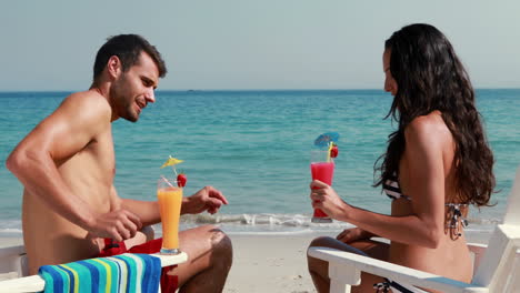 Happy-couple-drinking-a-cocktail-together