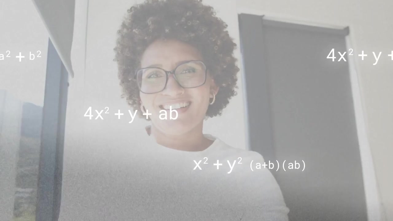 Vertical video: Smiling at cam, woman in glasses turning right at window teaching math with overlay