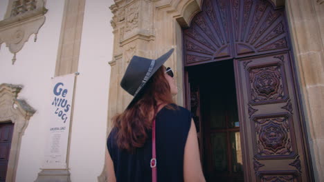 girl looking at church of mercy in viseu portugal entrance slow motion