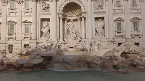 view on the front of trevi fountain in the historical center of rome