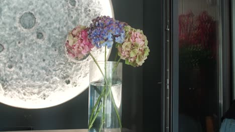 hydrangea bouquet in modern interior with moon decor