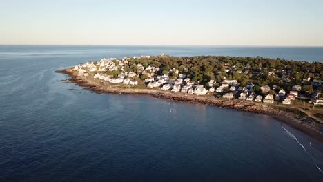 Aerial-drone-video-of-the-ocean-coastline-and-homes-at-Short-Sands-Beach-near-Cape-Neddick-and-York,-Maine,-United-States-of-America