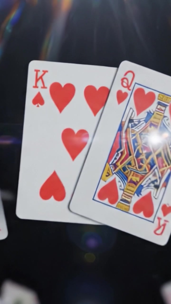A Mesmerizing Display of Flying Playing Cards with a Focus on Hearts - Capturing the Elegance and Excitement of Card Games in Motion