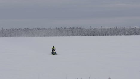 snowmobile traveling across frozen field towards camera, anchorage 4k