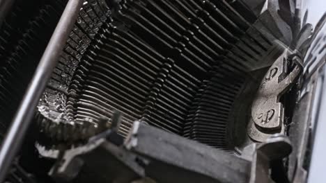 detailed close-up reveals the inner mechanical parts of a classic vintage typewriter
