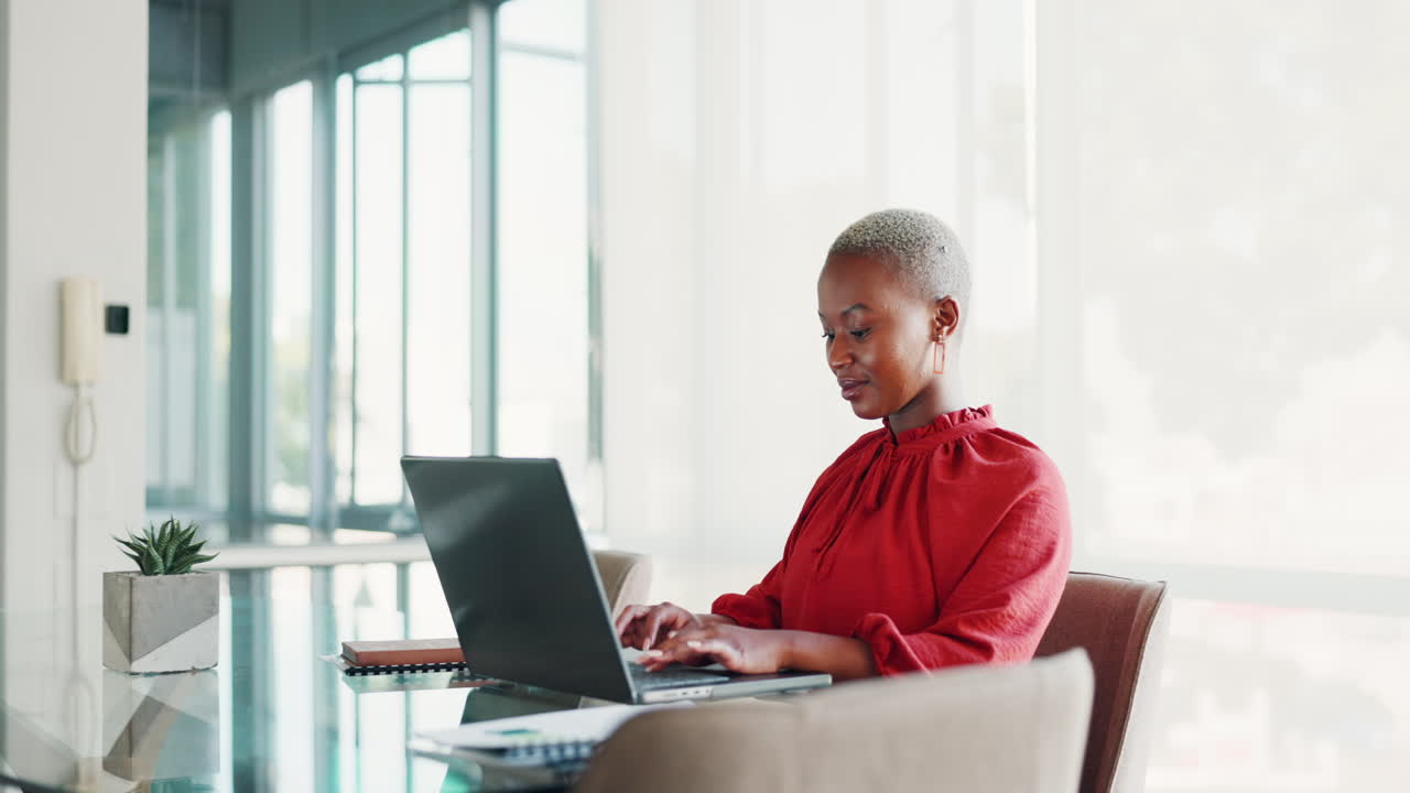 Office, business and black woman typing on laptop