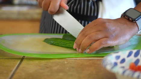 slicing cucumbers for a chopped salad - antipasto salad series