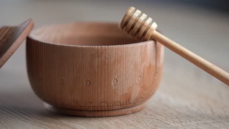 wooden bowl. close-up. healthy organic, wooden honey spoon, closeup.